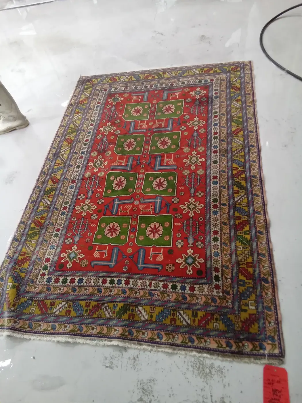Colorful tribal Kazak rug shown full, after washing